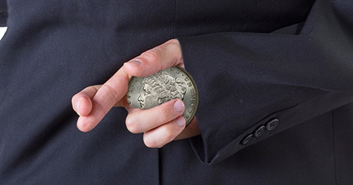 thief holding stolen coin