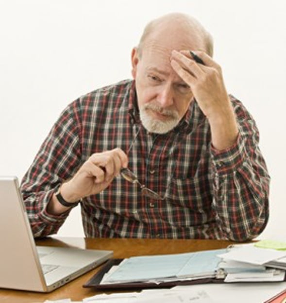 man stressed at laptop